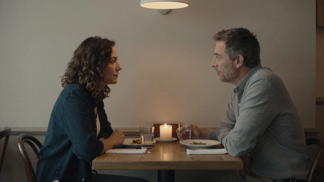 A man and woman having a quiet, respectful conversation over dinner in a London café.